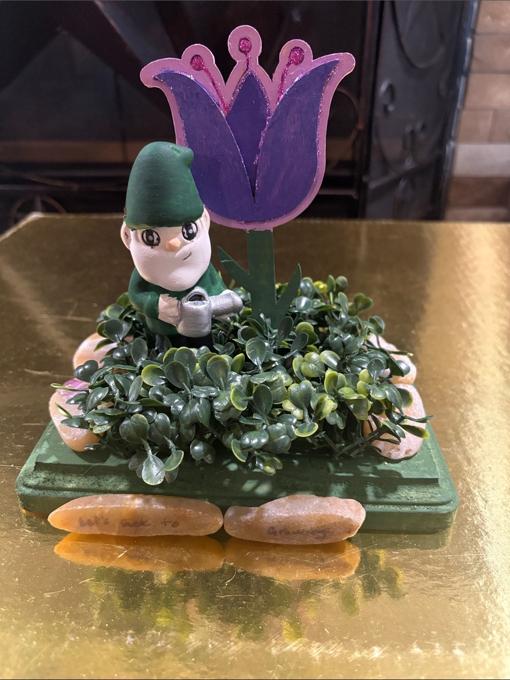 Whimsical Garden Gnome watering flower with turtle